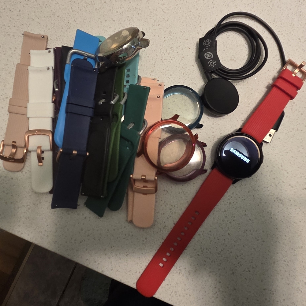 Samsung Smartwatch with Red Band and Accessories